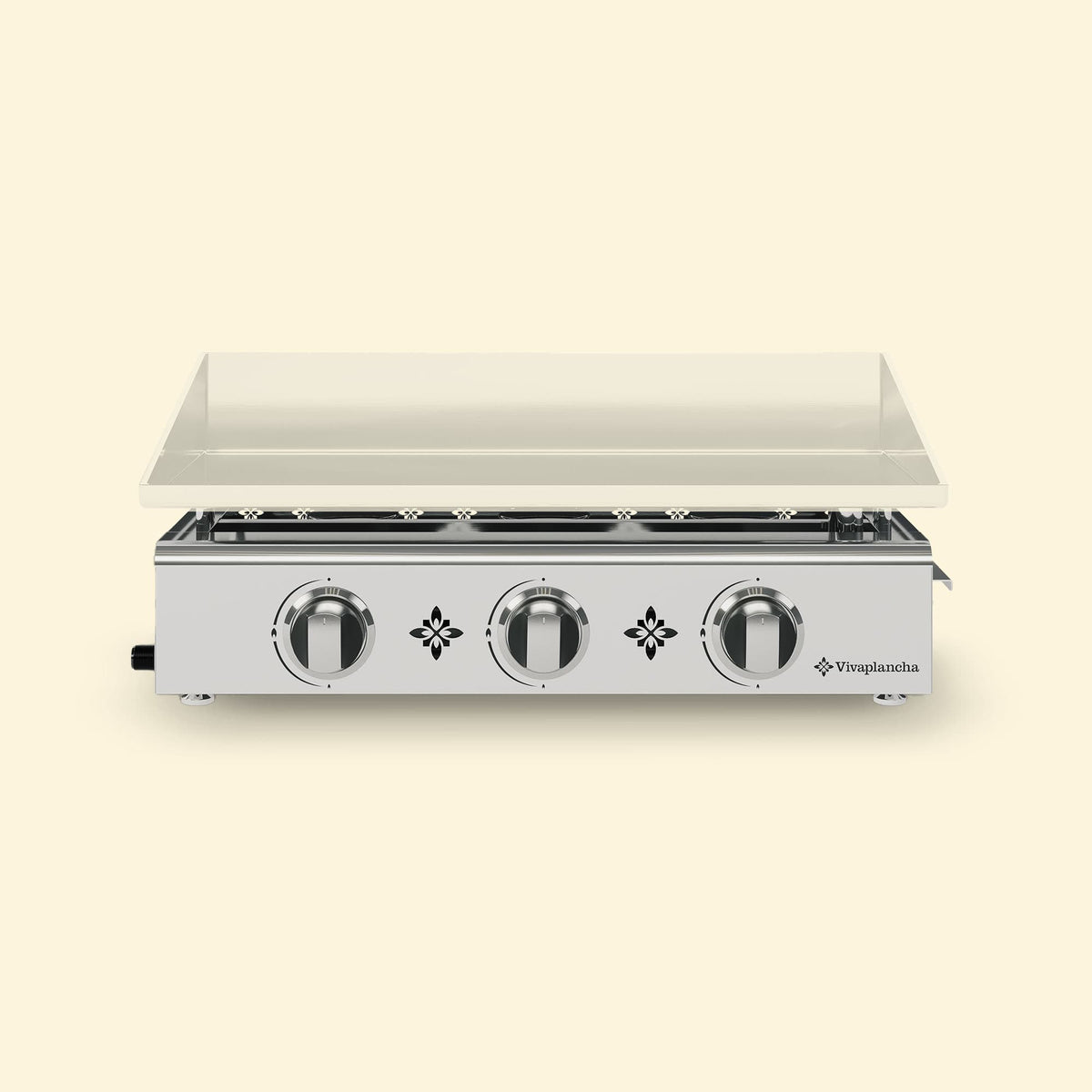 Plancha gaz Vivaplancha 3 brûleurs en inox, avec plaque de cuisson rectangulaire posée sur le châssis, présentée sur fond beige.